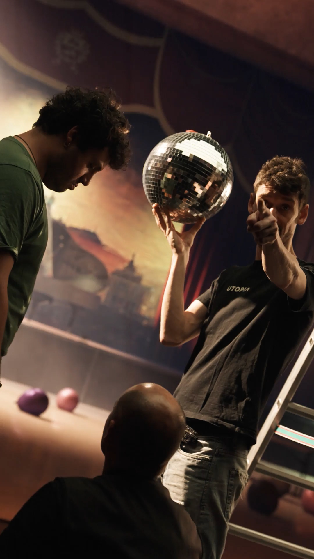 The crew positioning the mirror ball